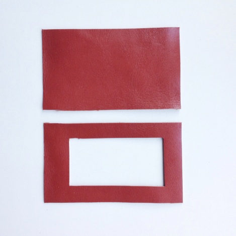 Cut out a smaller rectangle from one of the leather pieces