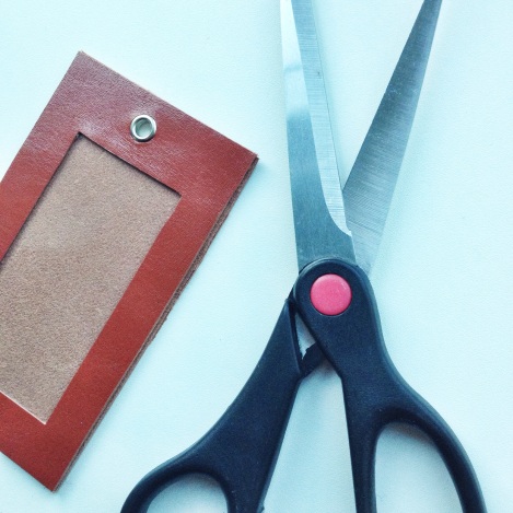 Assemble the pieces to make the luggage tag - trim off any excess leather